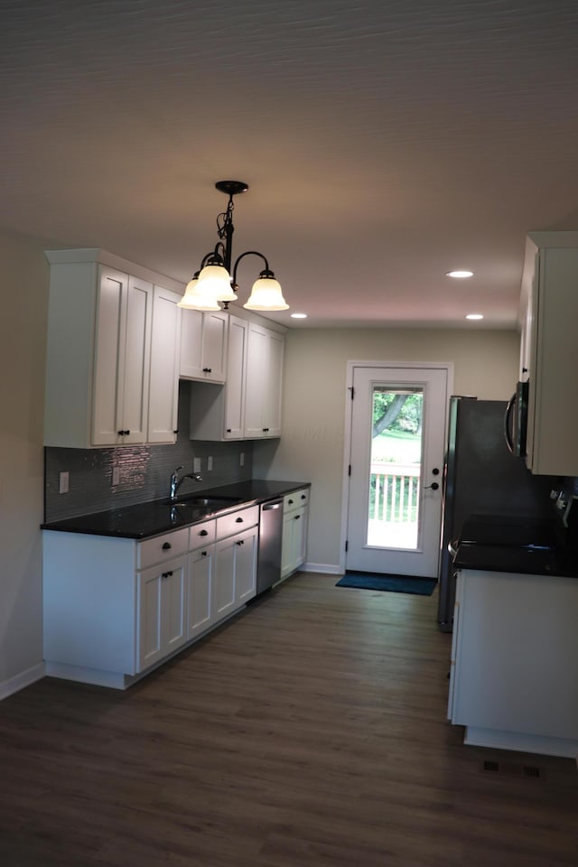 187 Twin Creek Way, Lancaster, OH 43130 - kitchen with dishwasher, baseboards, dark countertops, dark wood-style floors, and recessed lighting