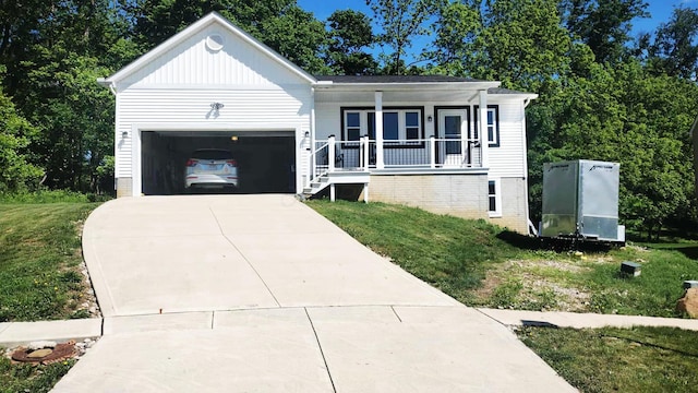 187 Twin Creek Way, Lancaster, OH 43130 - view of front of house with driveway, a porch, an attached garage, and a front yard