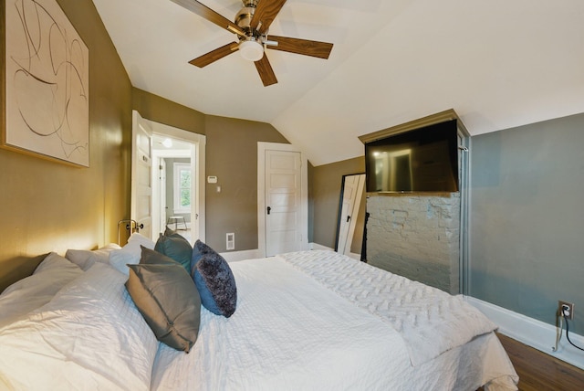 420 Stanley Ave, Columbus, OH 43206 - bedroom featuring baseboards, dark wood-style flooring, lofted ceiling, and a ceiling fan