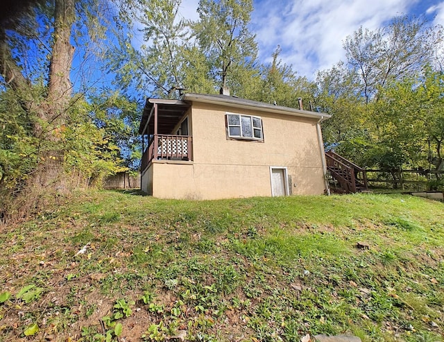 2108 Paul Dr, Columbus, OH 43211 - view of property exterior with stairway and stucco siding