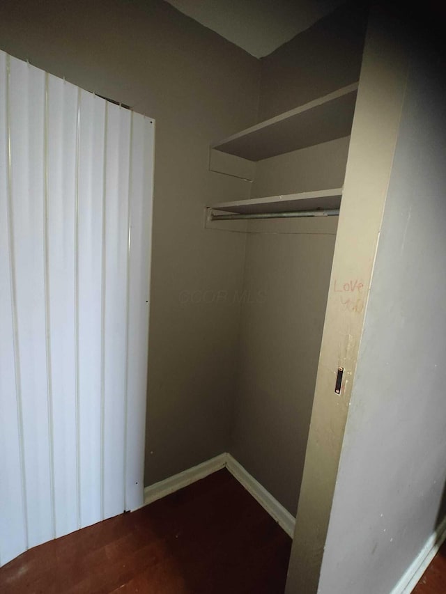 2108 Paul Dr, Columbus, OH 43211 - walk in closet with dark wood finished floors