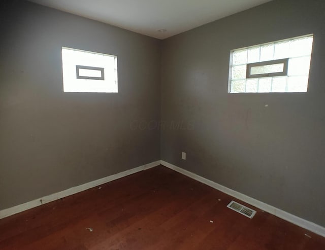 2108 Paul Dr, Columbus, OH 43211 - empty room with wood finished floors and baseboards