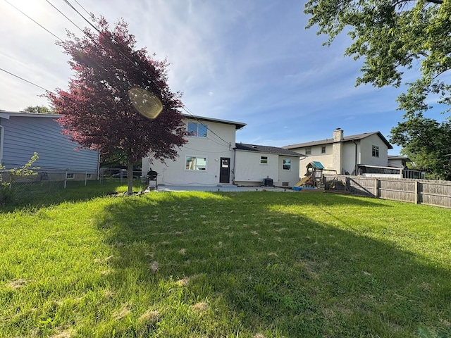 5464 Aspen Rd, Columbus, OH 43229 - back of house with a playground and a patio area