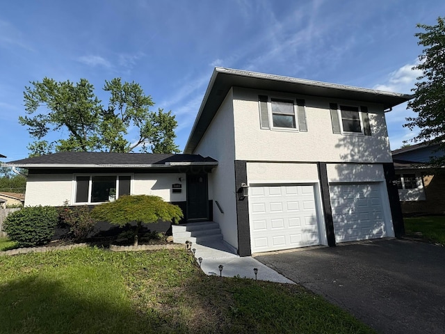 5464 Aspen Rd, Columbus, OH 43229 - view of front facade with stucco siding, driveway, and an attached garage