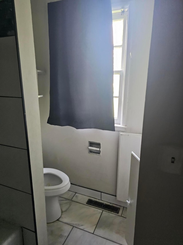 271 Carilla Ln, Columbus, OH 43228 - bathroom with toilet, healthy amount of natural light, and marble finish floors