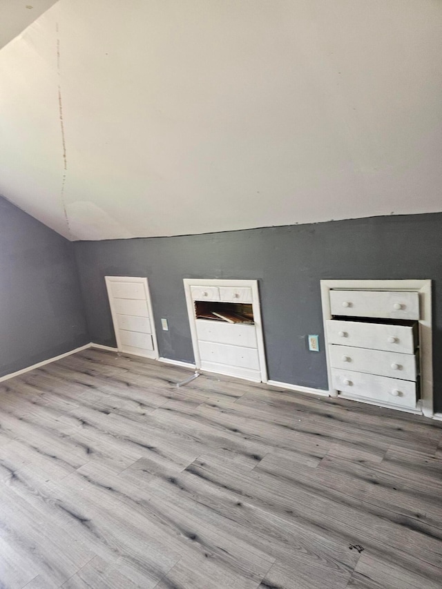 271 Carilla Ln, Columbus, OH 43228 - additional living space featuring vaulted ceiling, wood finished floors, and baseboards