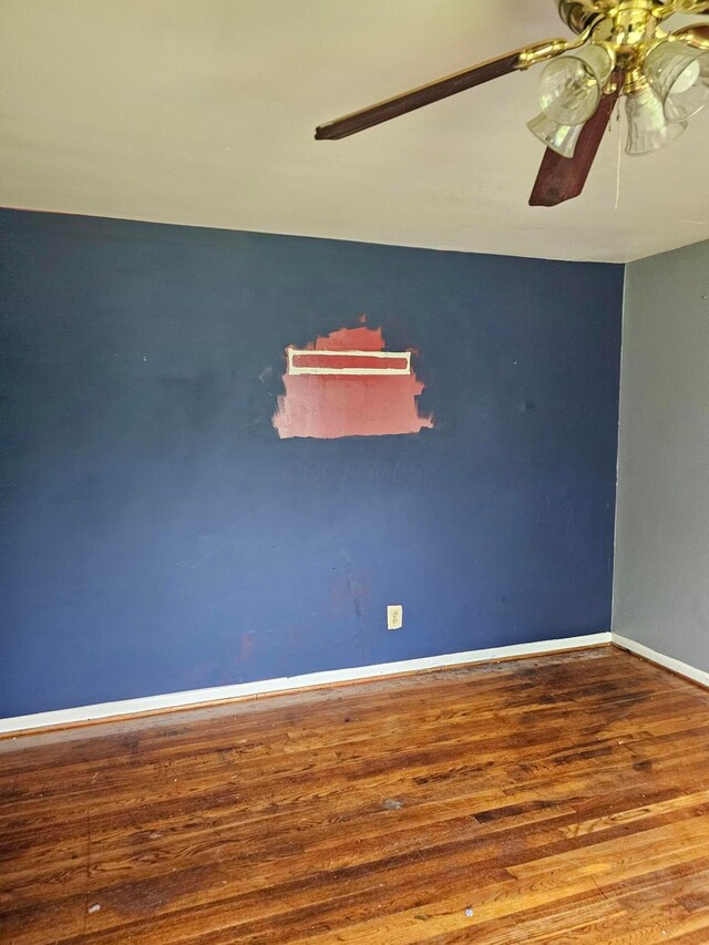 271 Carilla Ln, Columbus, OH 43228 - empty room with wood finished floors, a ceiling fan, and baseboards