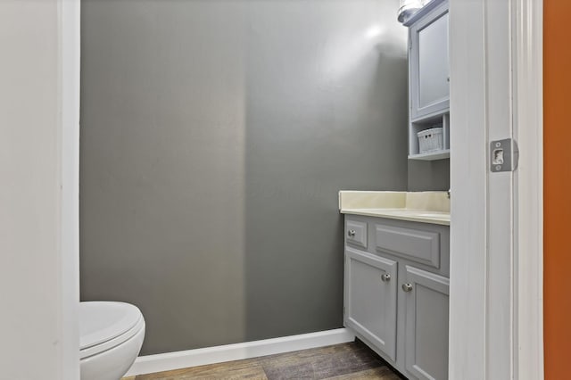 14609 Hock Hocking Rd, Logan, OH 43138 - bathroom with baseboards, vanity, toilet, and wood finished floors