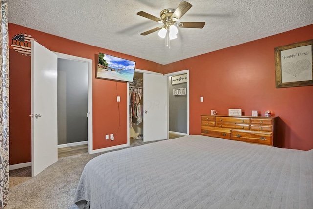 14609 Hock Hocking Rd, Logan, OH 43138 - bedroom with a textured ceiling, carpet floors, ceiling fan, and baseboards