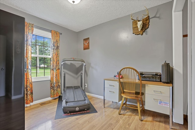 14609 Hock Hocking Rd, Logan, OH 43138 - office with light wood-style floors, a textured ceiling, and baseboards
