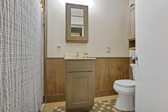 14609 Hock Hocking Rd, Logan, OH 43138 - bathroom with toilet, wainscoting, vanity, and a shower with shower curtain