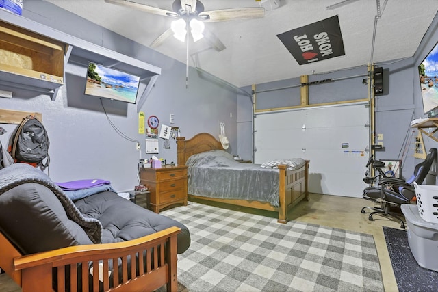 14609 Hock Hocking Rd, Logan, OH 43138 - bedroom featuring a garage, concrete flooring, and ceiling fan