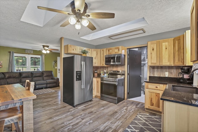 14609 Hock Hocking Rd, Logan, OH 43138 - kitchen with appliances with stainless steel finishes, a sink, ceiling fan, a textured ceiling, and open floor plan