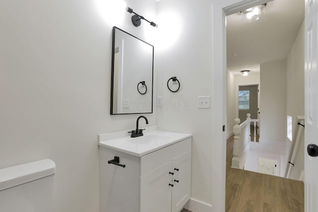 1676 Parsons Ave, Columbus, OH 43207 - bathroom featuring vanity, toilet, and baseboards
