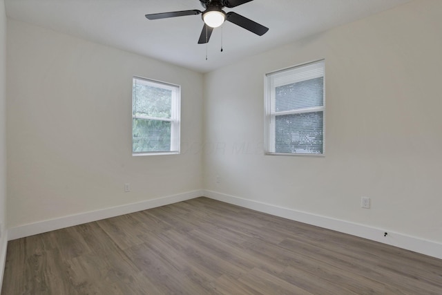 1676 Parsons Ave, Columbus, OH 43207 - empty room with wood finished floors, baseboards, and ceiling fan