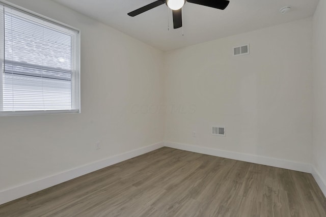 1676 Parsons Ave, Columbus, OH 43207 - spare room with baseboards, a ceiling fan, wood finished floors, and a smoke detector