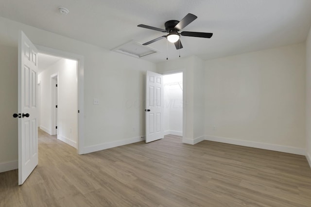 1676 Parsons Ave, Columbus, OH 43207 - empty room with attic access, baseboards, and light wood-type flooring