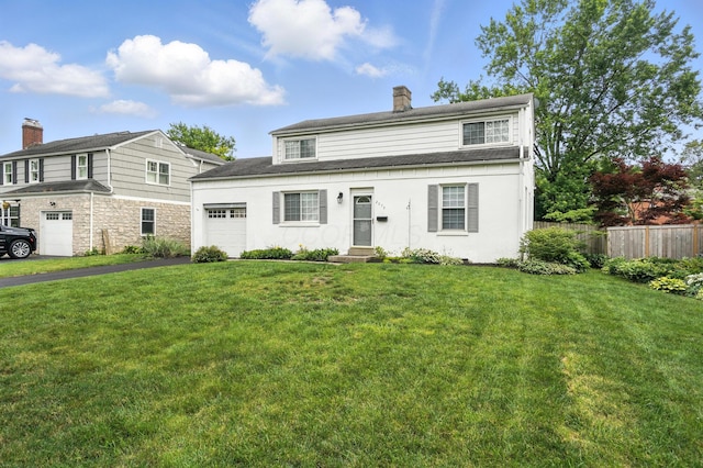 2079 Inchcliff Rd, Upper Arlington, OH 43221 - view of front of property featuring a garage, a chimney, driveway, and entry steps