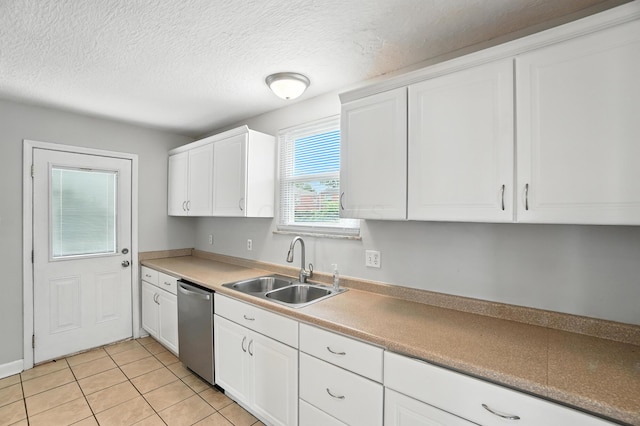 2079 Inchcliff Rd, Upper Arlington, OH 43221 - kitchen featuring dishwasher, white cabinetry, light tile patterned flooring, a textured ceiling, and light countertops