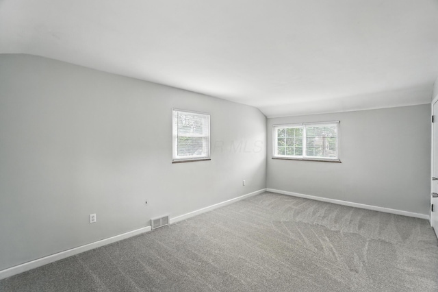 2079 Inchcliff Rd, Upper Arlington, OH 43221 - empty room with vaulted ceiling and carpet flooring