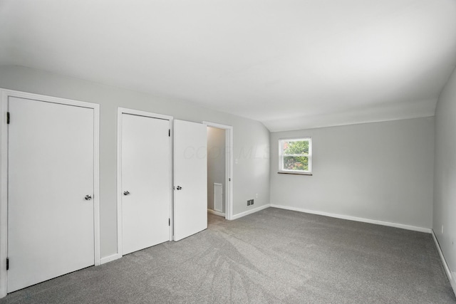 2079 Inchcliff Rd, Upper Arlington, OH 43221 - unfurnished bedroom featuring carpet flooring and lofted ceiling