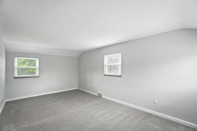 2079 Inchcliff Rd, Upper Arlington, OH 43221 - carpeted spare room featuring vaulted ceiling and healthy amount of natural light