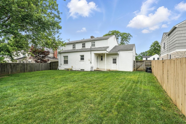 2079 Inchcliff Rd, Upper Arlington, OH 43221 - rear view of house featuring a fenced backyard, a gate, stucco siding, a chimney, and a shingled roof