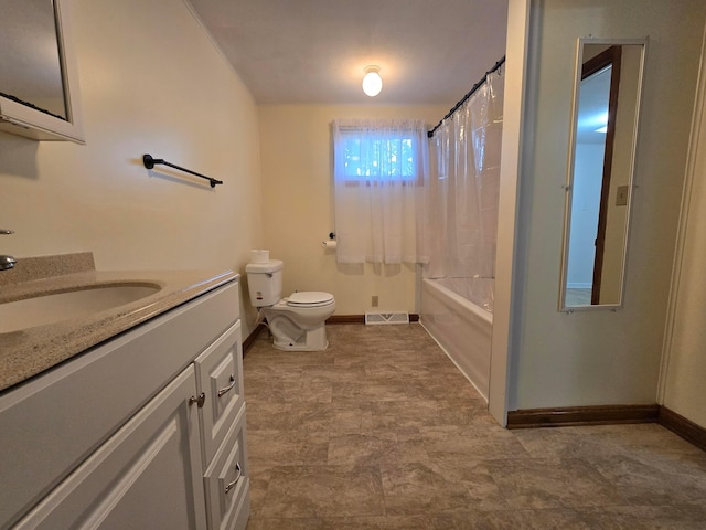 405 E 5th St, West Lafayette, OH 43845 - bathroom with vanity, baseboards, toilet, and shower / bath combo with shower curtain