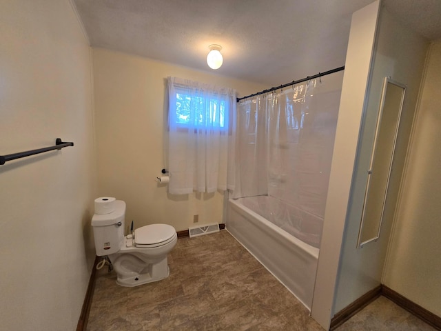 405 E 5th St, West Lafayette, OH 43845 - bathroom with baseboards, toilet, and shower / tub combo