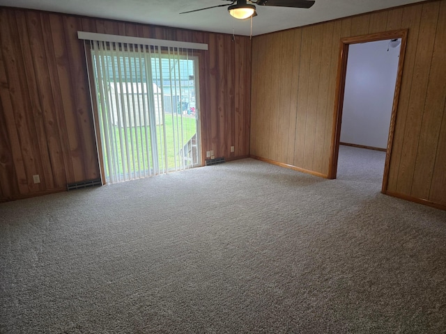 405 E 5th St, West Lafayette, OH 43845 - carpeted spare room with ceiling fan, wooden walls, and baseboards