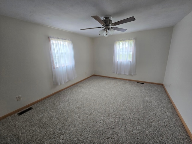 405 E 5th St, West Lafayette, OH 43845 - carpeted spare room featuring healthy amount of natural light, ceiling fan, and baseboards