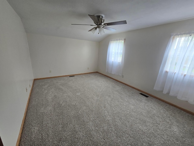 405 E 5th St, West Lafayette, OH 43845 - carpeted spare room with a ceiling fan, lofted ceiling, and baseboards