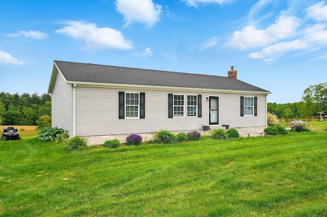 9842 State Route 757 NW, Somerset, OH 43783 - view of front of house with a front yard, a chimney, and a shingled roof