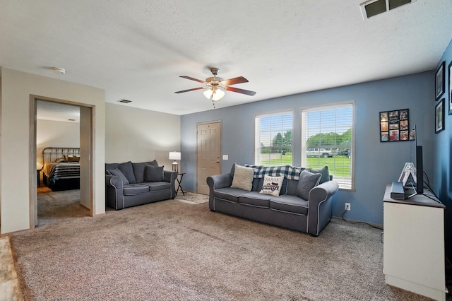 9842 State Route 757 NW, Somerset, OH 43783 - carpeted living area with a ceiling fan and a textured ceiling