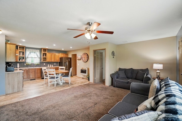 9842 State Route 757 NW, Somerset, OH 43783 - living room with heating unit, a ceiling fan, recessed lighting, light carpet, and light wood-style flooring