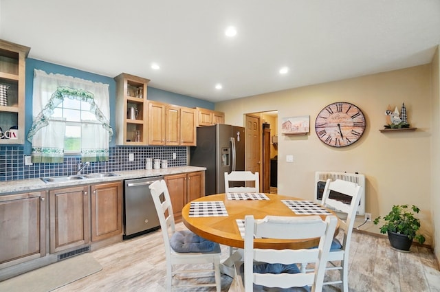 9842 State Route 757 NW, Somerset, OH 43783 - kitchen featuring stainless steel appliances, heating unit, open shelves, a sink, and backsplash