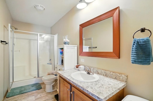 9842 State Route 757 NW, Somerset, OH 43783 - full bathroom with toilet, a shower stall, vanity, and wood finished floors