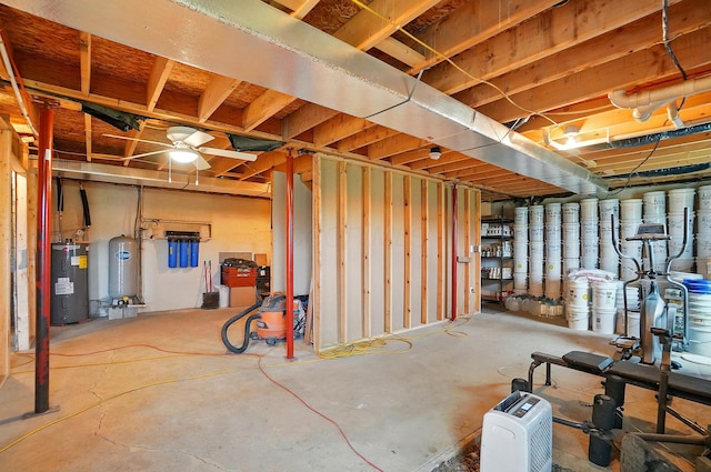 9842 State Route 757 NW, Somerset, OH 43783 - unfinished below grade area with water heater and a water pressure tank