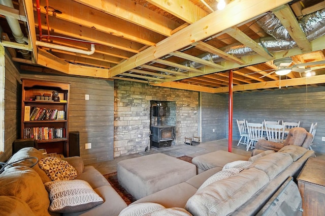 9842 State Route 757 NW, Somerset, OH 43783 - living room featuring a wood stove and wood walls