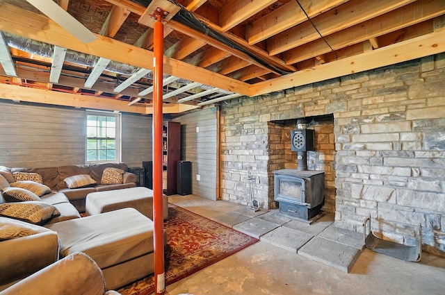 9842 State Route 757 NW, Somerset, OH 43783 - living area with a wood stove and unfinished concrete floors