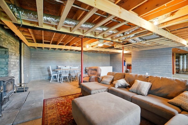 9842 State Route 757 NW, Somerset, OH 43783 - living area featuring a wood stove and unfinished concrete flooring
