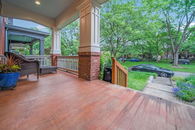 663 Wilson Ave, Columbus, OH 43205 - wooden porch with a lawn