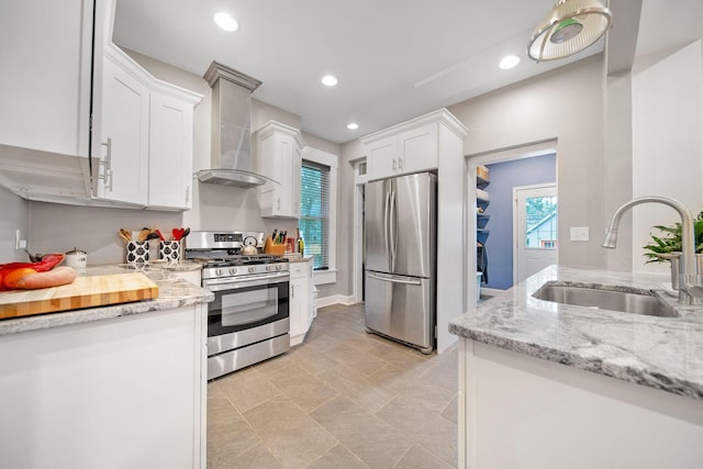 663 Wilson Ave, Columbus, OH 43205 - kitchen featuring stainless steel appliances, a sink, wall chimney exhaust hood, white cabinetry, and light stone countertops