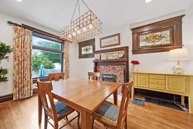 663 Wilson Ave, Columbus, OH 43205 - dining space featuring light wood-style floors and a fireplace