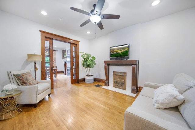 663 Wilson Ave, Columbus, OH 43205 - living room featuring ceiling fan, a brick fireplace, hardwood / wood-style floors, baseboards, and recessed lighting
