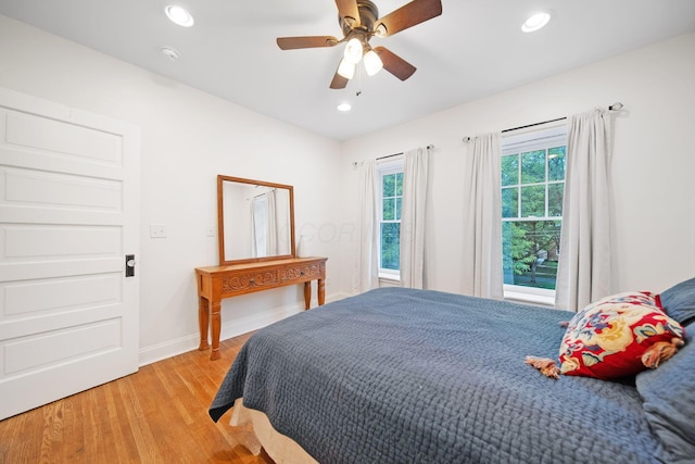 663 Wilson Ave, Columbus, OH 43205 - bedroom with light wood-style flooring, recessed lighting, baseboards, and ceiling fan