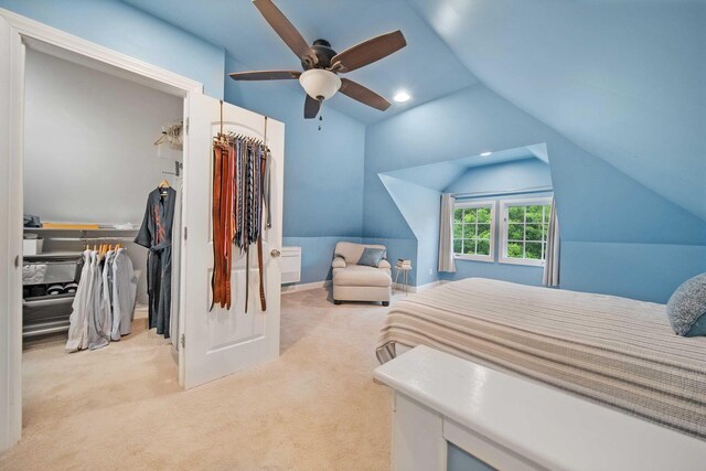 663 Wilson Ave, Columbus, OH 43205 - carpeted bedroom with lofted ceiling, a closet, a walk in closet, and ceiling fan