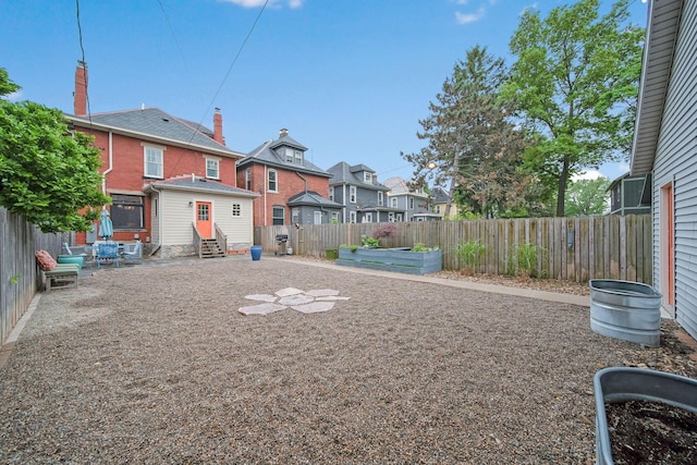 663 Wilson Ave, Columbus, OH 43205 - fenced backyard with entry steps, a residential view, and a vegetable garden
