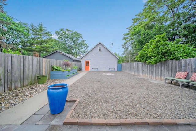 663 Wilson Ave, Columbus, OH 43205 - view of side of property with a fenced backyard and a garden