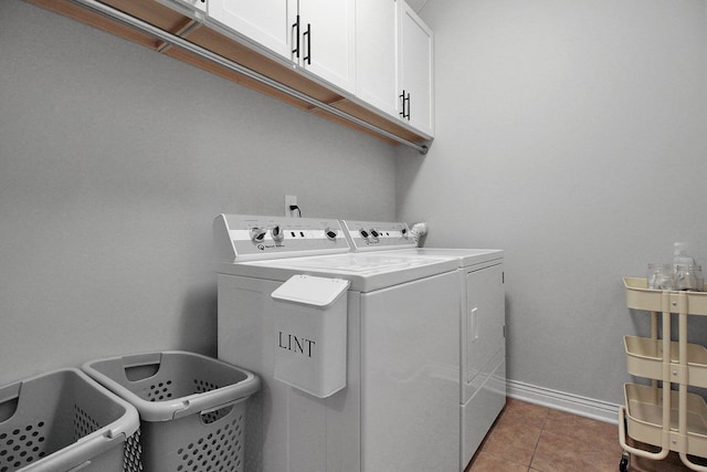 7313 Bromfield Dr, Canal Winchester, OH 43110 - laundry room with washing machine and dryer, cabinet space, light tile patterned floors, and baseboards